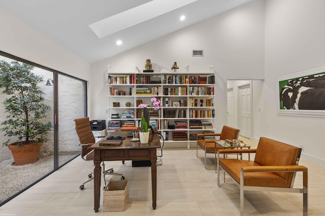 office space featuring a skylight, visible vents, high vaulted ceiling, and recessed lighting