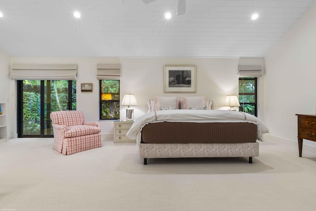 carpeted bedroom featuring vaulted ceiling and recessed lighting