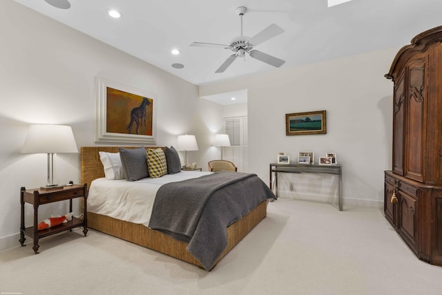 bedroom featuring light carpet, ceiling fan, baseboards, and recessed lighting