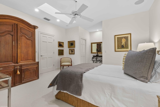 bedroom featuring recessed lighting, light carpet, a skylight, a ceiling fan, and visible vents