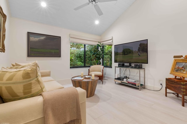 living area featuring a ceiling fan, recessed lighting, vaulted ceiling, and baseboards