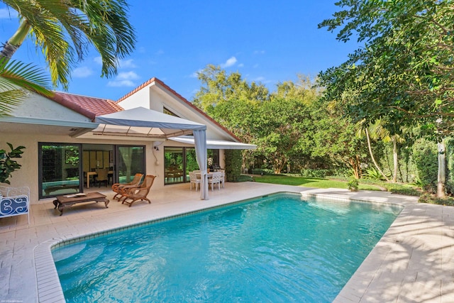 outdoor pool featuring a patio and outdoor dining space