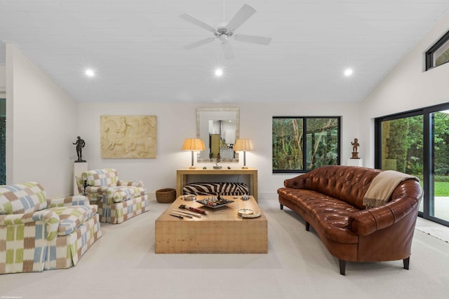 carpeted living area featuring lofted ceiling, ceiling fan, and recessed lighting