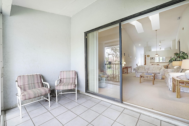 balcony with an outdoor hangout area and visible vents