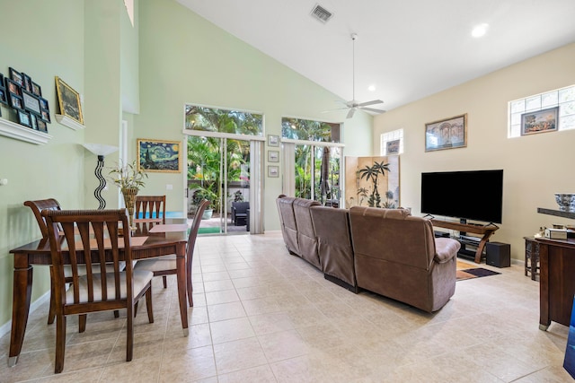 living room with light tile patterned floors, high vaulted ceiling, ceiling fan, visible vents, and baseboards