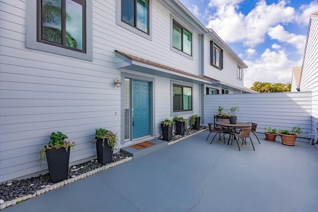 view of patio / terrace with outdoor dining space and fence