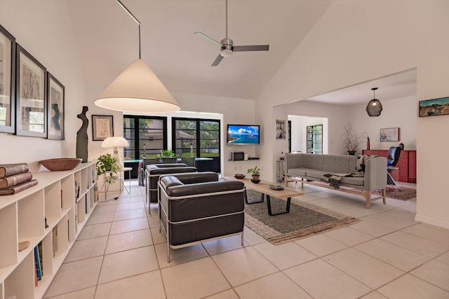 living room featuring high vaulted ceiling, tile patterned flooring, and a ceiling fan