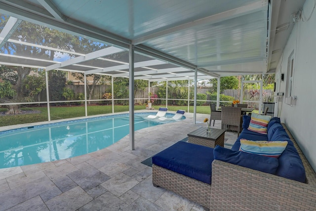 view of swimming pool with a lanai, a fenced backyard, a fenced in pool, and a patio