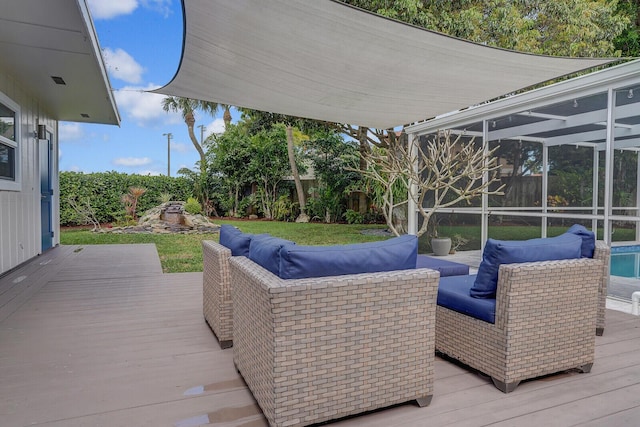 wooden terrace featuring glass enclosure and outdoor lounge area