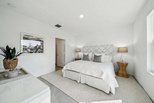 bedroom with baseboards, visible vents, and recessed lighting