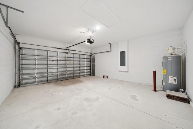 garage featuring a garage door opener, electric panel, and water heater