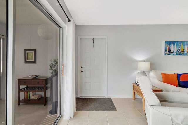 foyer entrance featuring light tile patterned flooring