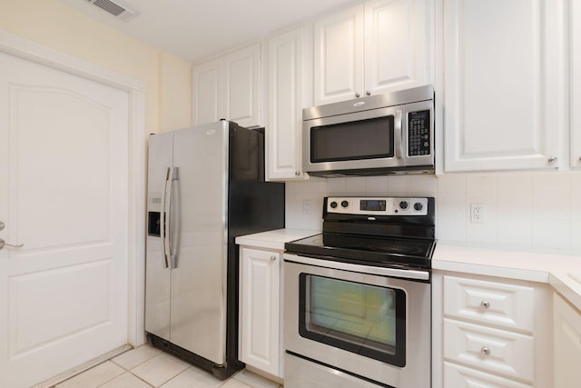 kitchen featuring white cabinetry, visible vents, stainless steel appliances, and light countertops