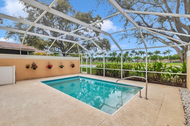 pool with a lanai and a patio