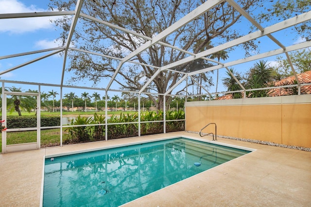 outdoor pool featuring a lanai and a patio