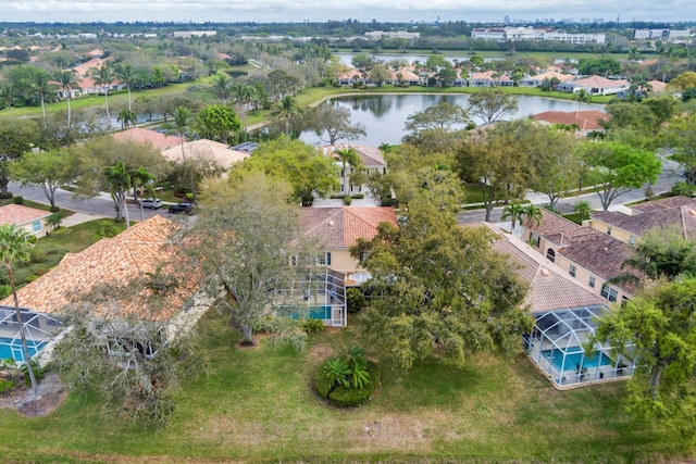 birds eye view of property featuring a water view and a residential view