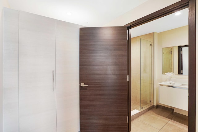 full bathroom featuring a shower stall, vanity, and tile patterned floors