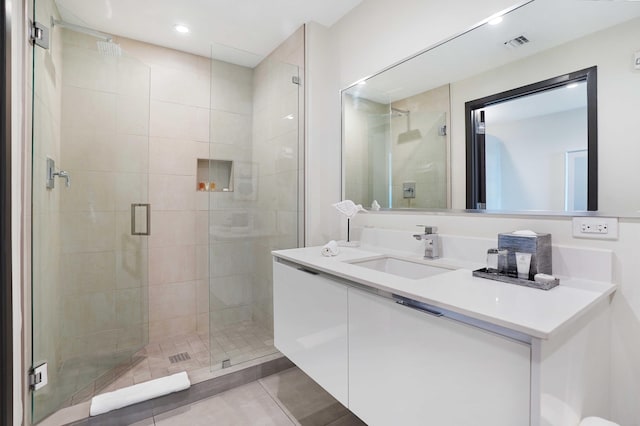 full bath featuring a stall shower, visible vents, tile patterned flooring, vanity, and recessed lighting