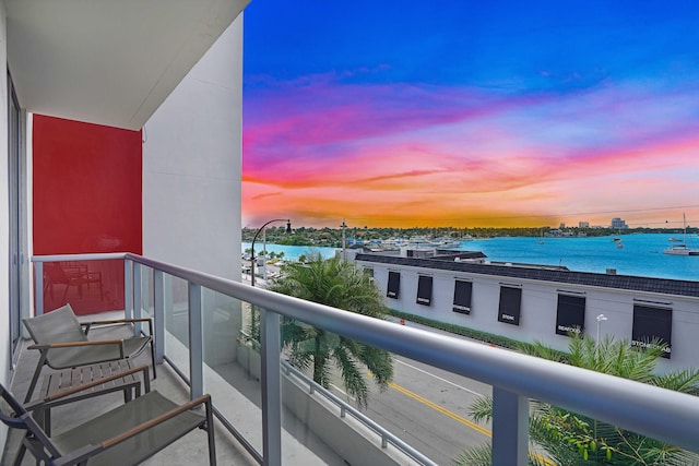 balcony at dusk with a water view