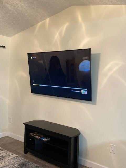 interior details featuring baseboards and a textured ceiling