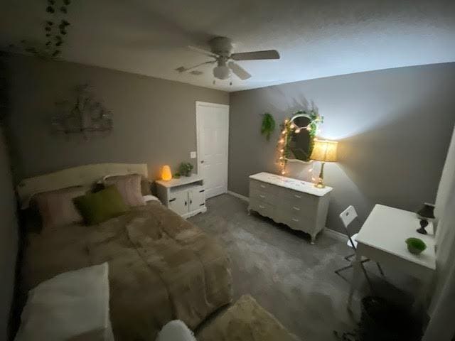 bedroom featuring carpet floors, ceiling fan, and baseboards