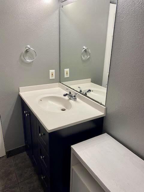 bathroom featuring tile patterned floors and vanity