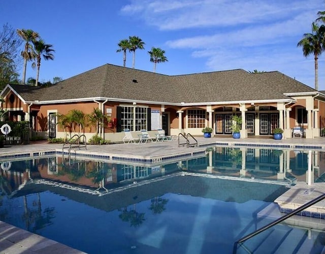 community pool featuring a patio area