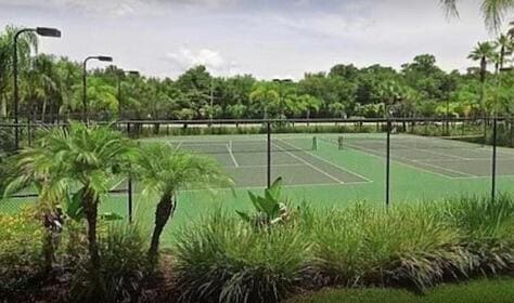 view of sport court with fence