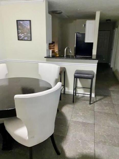 dining room featuring crown molding