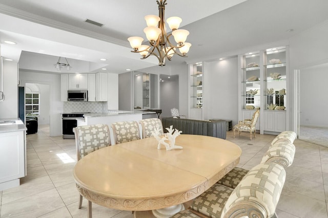 dining area featuring light tile patterned flooring, recessed lighting, crown molding, visible vents, and an inviting chandelier