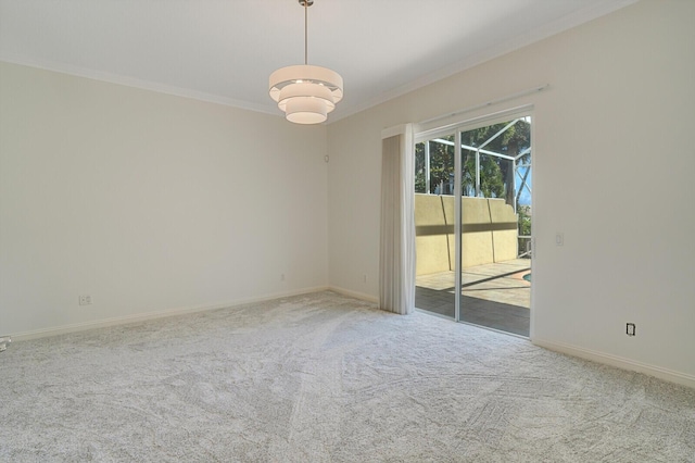 empty room featuring ornamental molding, light carpet, and baseboards