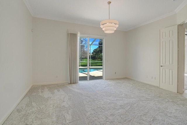 spare room with baseboards, ornamental molding, and light colored carpet