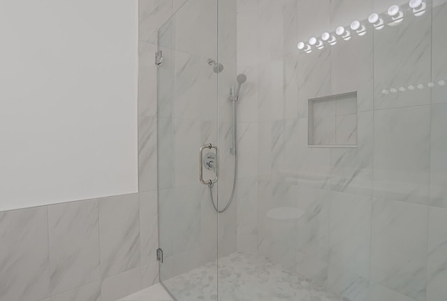 full bath featuring a shower stall