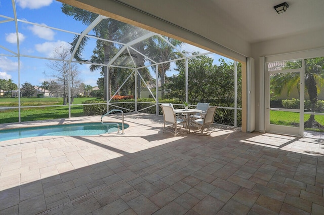 outdoor pool with a lanai and a patio