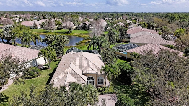 bird's eye view featuring a water view and a residential view