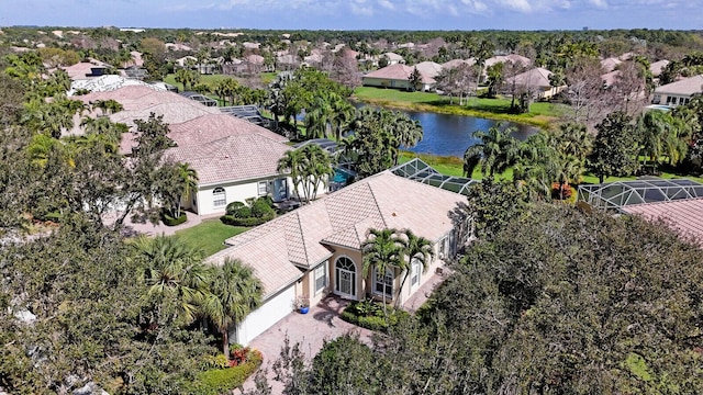 drone / aerial view featuring a water view and a residential view