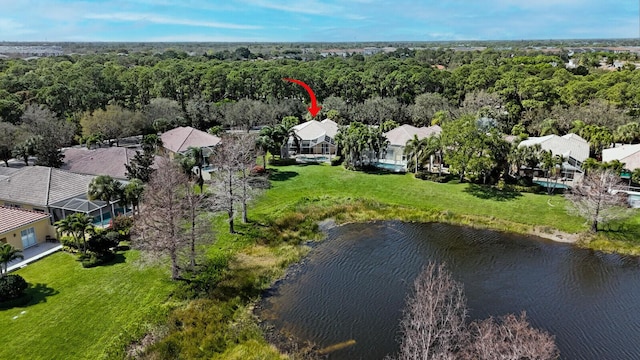 birds eye view of property with a residential view and a water view