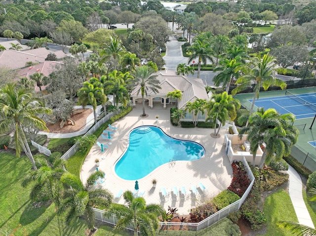 pool with fence and a patio