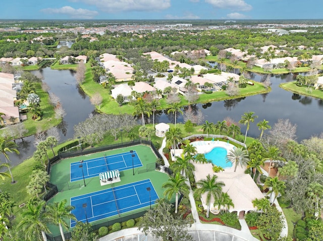 birds eye view of property featuring a water view and a residential view