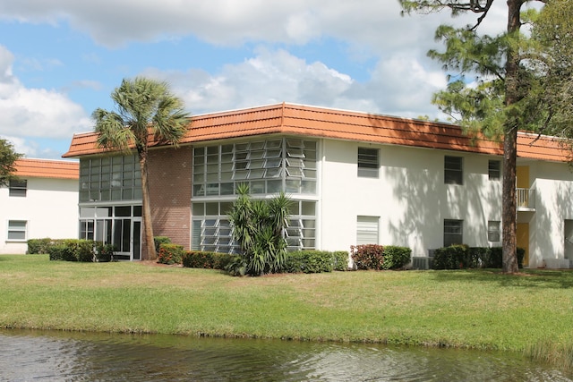 view of building exterior featuring a water view