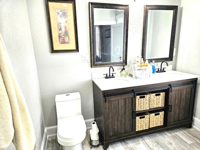 206 Edgewood Dr, West Palm Beach, FL 33405 - full bathroom featuring a sink, baseboards, toilet, and double vanity