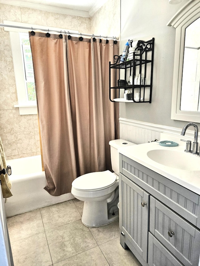 206 Edgewood Dr, West Palm Beach, FL 33405 - full bath featuring toilet, shower / tub combo with curtain, wainscoting, tile patterned floors, and vanity