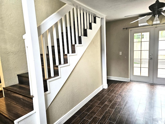 206 Edgewood Dr, West Palm Beach, FL 33405 - staircase featuring a textured wall, wood finished floors, french doors, and ceiling fan