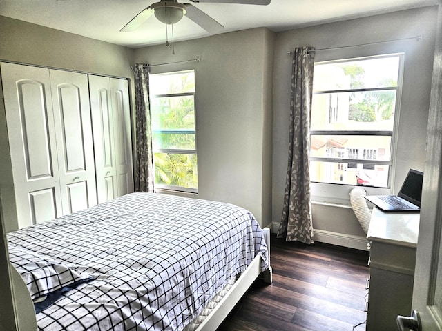 206 Edgewood Dr, West Palm Beach, FL 33405 - bedroom featuring baseboards, dark wood-style flooring, a closet, and ceiling fan
