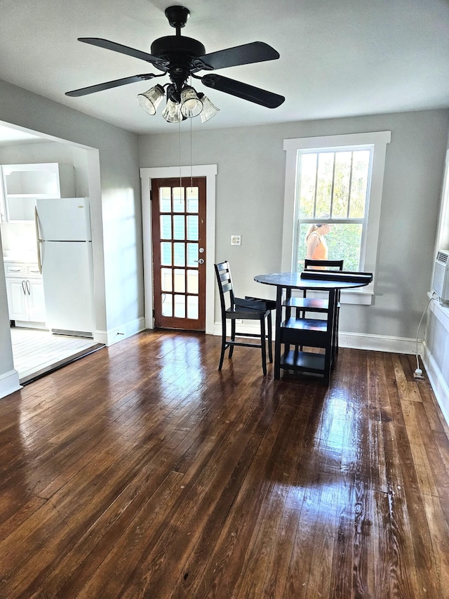 206 Edgewood Dr, West Palm Beach, FL 33405 - dining room featuring baseboards, wood-type flooring, and a ceiling fan