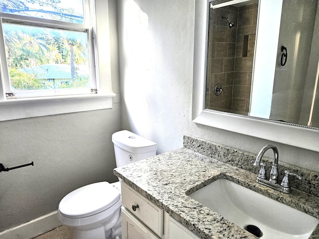 206 Edgewood Dr, West Palm Beach, FL 33405 - full bathroom with vanity, toilet, a textured wall, and walk in shower