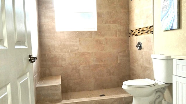 206 Edgewood Dr, West Palm Beach, FL 33405 - bathroom featuring tiled shower, toilet, and vanity