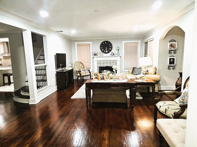206 Edgewood Dr, West Palm Beach, FL 33405 - living area with crown molding, baseboards, stairway, a fireplace, and wood finished floors