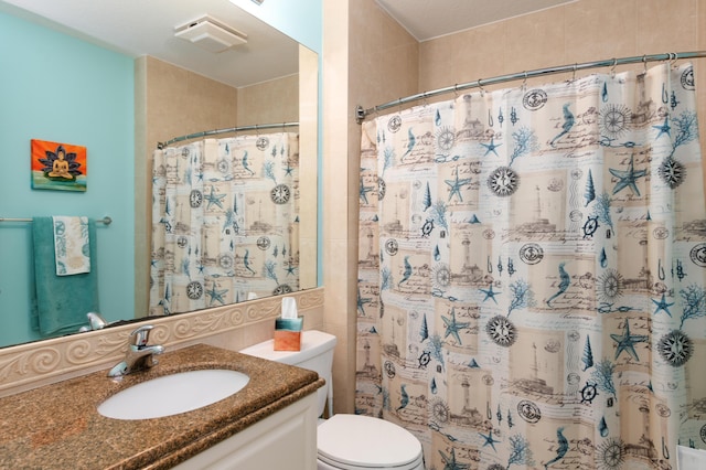 bathroom with toilet, a shower with curtain, visible vents, and vanity