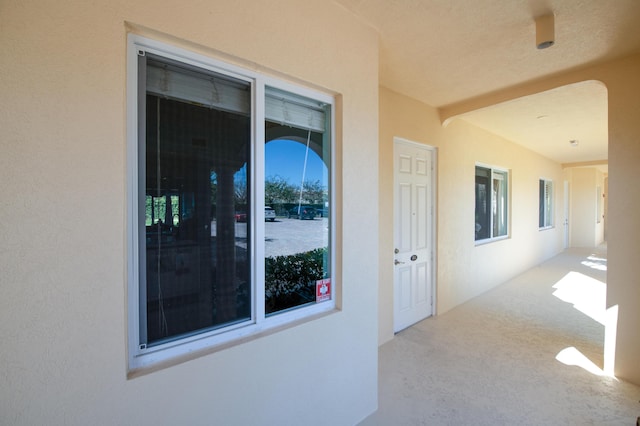 property entrance featuring a patio